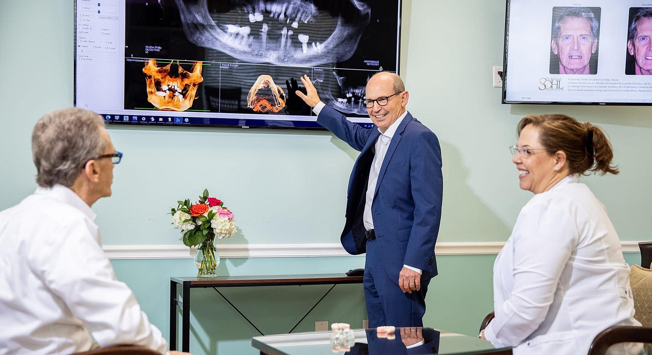 Dental professionals discussing patient imaging and treatment.