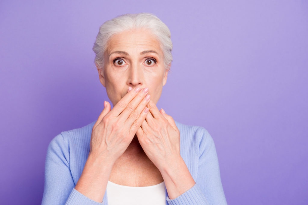 Woman Covering Smile