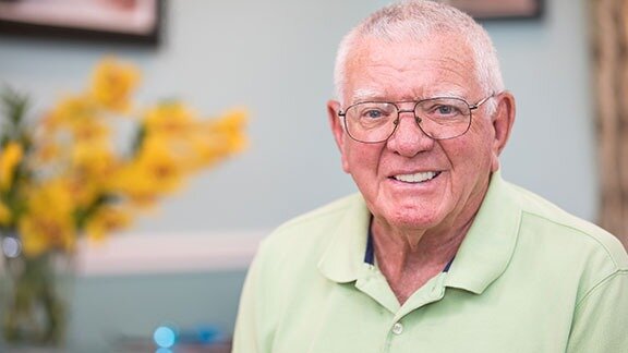 Stuart All-on-4 Dental Implants Patient Sitting and Smiling